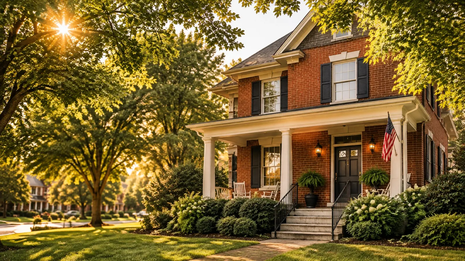 Brick home with a covered porch in a leafy Nashville neighborhood